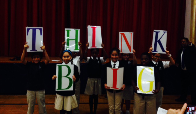 kids with THINK BIG banner