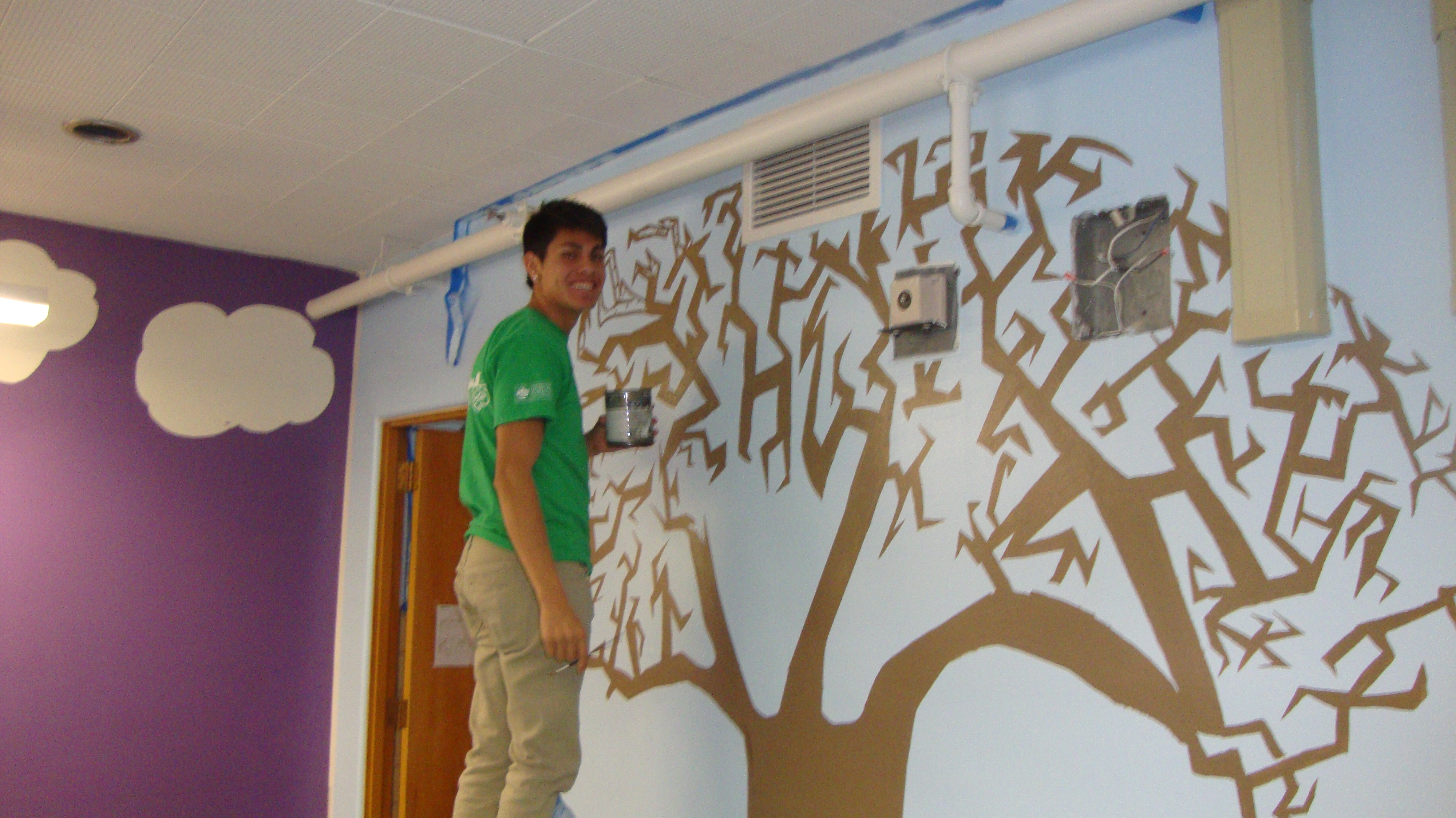 student painting tree